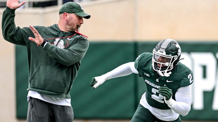 Michigan State's Khris Bogle, right, runs a drill with rush ends coach Chad Wilt during the Spring Showcase on Saturday, April 20, 2024, at Spartan Stadium in East Lansing.
