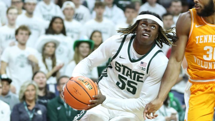 Michigan State Spartans forward Coen Carr (55) drives against Tennessee Volunteers guard Josiah-Jordan James (30) during first-half action at Breslin Center in East Lansing on Sunday, Oct. 29, 2023.