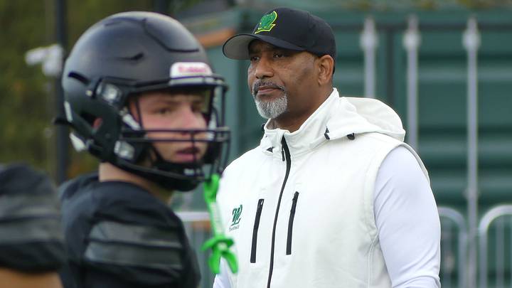 West Linn coach Anthony Newman watches warmups before Friday's 45-20 season-opening victory over Central Catholic..