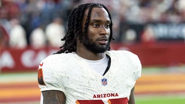 Sep 25, 2025; Glendale, Arizona, USA; Arizona Cardinals running back Michael Carter (22) against the Seattle Seahawks at State Farm Stadium. Mandatory Credit: Mark J. Rebilas-Imagn Images