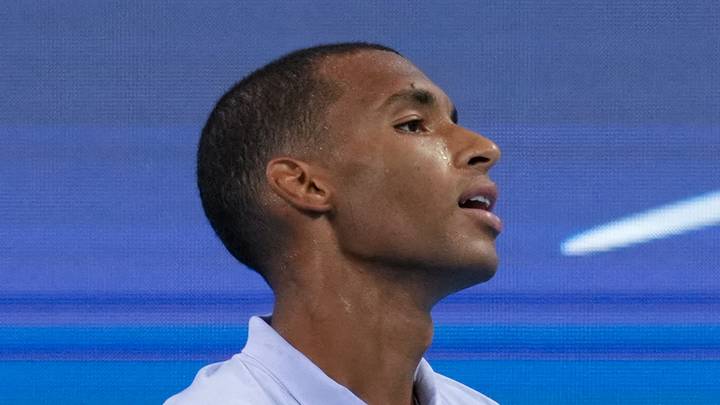 Felix Auger-Aliassime reacts after returning a shot