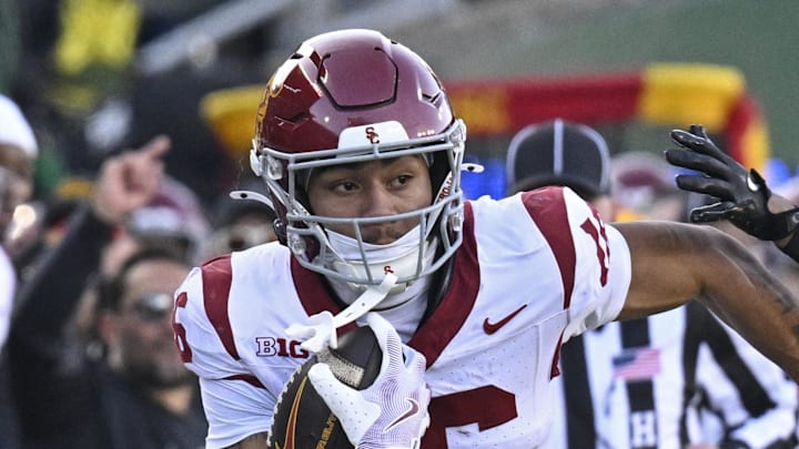 Nov 22, 2025; Eugene, Oregon, USA; Southern California Trojans wide receiver Tanook Hines (16) runs with the ball during the first half against the Oregon Ducks at Autzen Stadium. Mandatory Credit: Troy Wayrynen-Imagn Images Nov 22, 2025; Eugene, Oregon, USA; Southern California Trojans wide receiver Tanook Hines (16) runs with the ball during the first half against the Oregon Ducks at Autzen Stadium. Mandatory Credit: Troy Wayrynen-Imagn Images