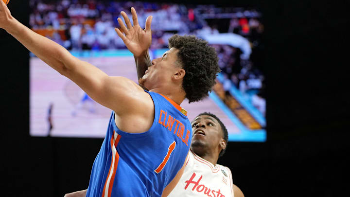 Apr 7, 2025; San Antonio, TX, USA; Florida Gators guard Walter Clayton Jr. (1) shoots the ball as Houston Cougars guard Terrance Arceneaux (23) attempts a block during the second half of the national championship game of the Final Four of the 2025 NCAA Tournament at the Alamodome. Mandatory Credit: Bob Donnan-Imagn Images Apr 7, 2025; San Antonio, TX, USA; Florida Gators guard Walter Clayton Jr. (1) shoots the ball as Houston Cougars guard Terrance Arceneaux (23) attempts a block during the second half of the national championship game of the Final Four of the 2025 NCAA Tournament at the Alamodome. Mandatory Credit: Bob Donnan-Imagn Images