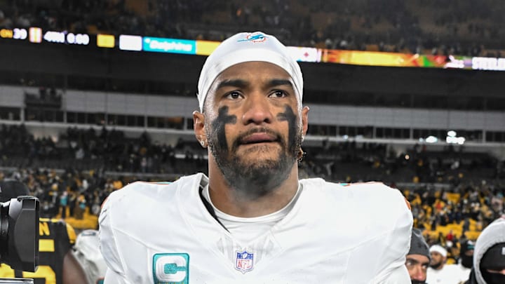 Dec 15, 2025; Pittsburgh, Pennsylvania, USA; Miami Dolphins quarterback Tua Tagovailoa (1) leaves the  field following a game against the Pittsburgh Steelers at Acrisure Stadium. Mandatory Credit: Barry Reeger-Imagn Images