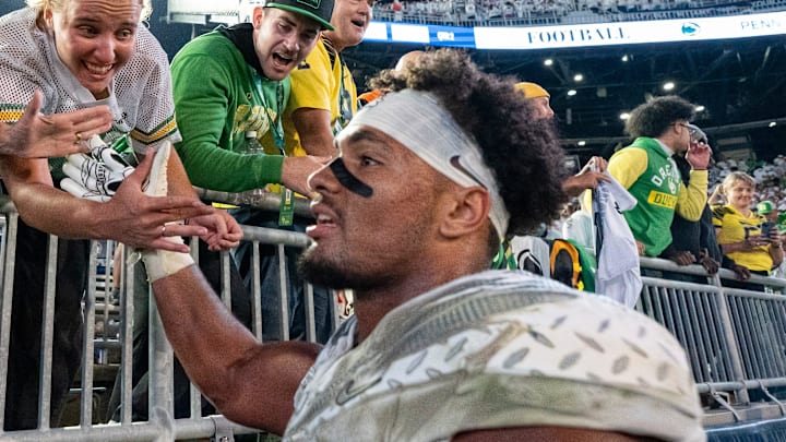 Oregon tight end Kenyon Sadiq celebrates with fans as the Oregon Ducks face the Penn State Nittany Lions on Sept. 27, 2025, at Beaver Stadium in University Park, Pennsylvania.