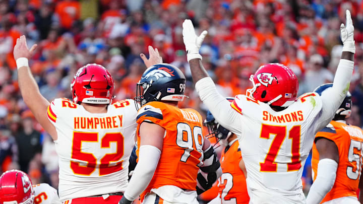 Nov 16, 2025; Denver, Colorado, USA; Kansas City Chiefs center Creed Humphrey (52) and offensive tackle Josh Simmons (71) celebrate a touchdown carry by running back Kareem Hunt (29) (center) in the third quarter against the Denver Broncos at Empower Field at Mile High. Mandatory Credit: Ron Chenoy-Imagn Images