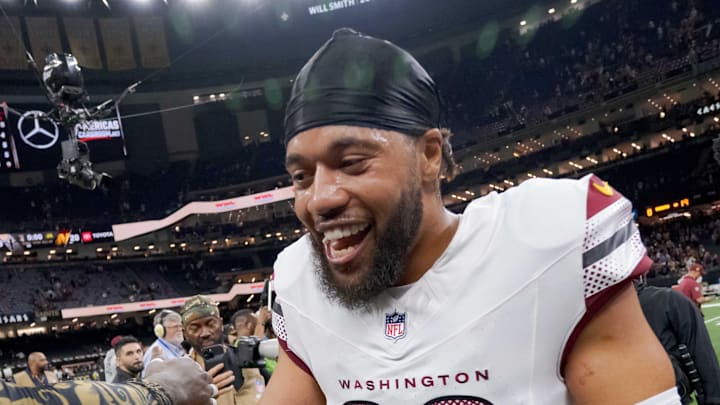 New Orleans Saints linebacker Demario Davis greets former teammate Washington Commanders cornerback Marshon Lattimore.