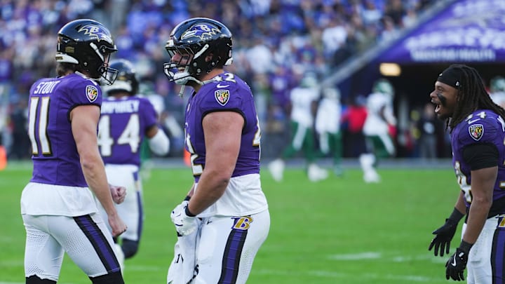 Nov 23, 2025; Baltimore, Maryland, USA; Baltimore Ravens punter Jordan Stout (11) and Baltimore Ravens fullback Patrick Ricard (42) celebrate after the game against the New York Jets at M&T Bank Stadium. Mandatory Credit: Mitch Stringer-Imagn Images
