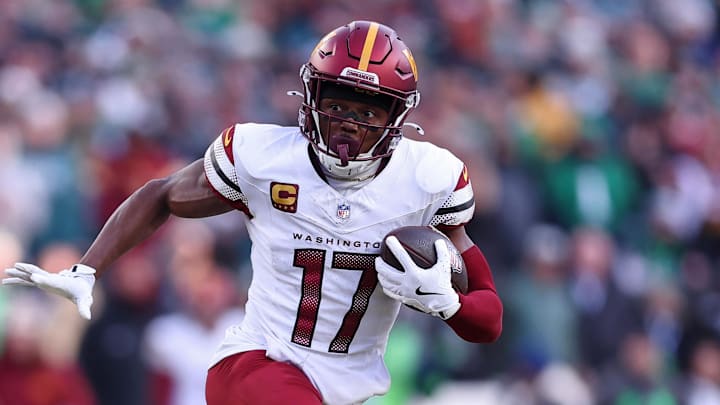 Washington Commanders wide receiver Terry McLaurin runs with the ball for a touchdown.