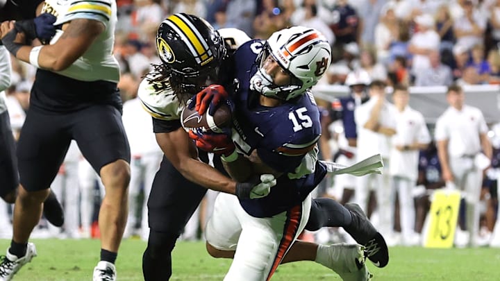 Oct 18, 2025; Auburn, Alabama, USA; Missouri Tigers safety Santana Banner tackles Auburn Tigers tight end Preston Howard during the second overtime at Jordan-Hare Stadium.