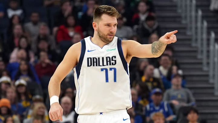 Dec 15, 2024; San Francisco, California, USA; Dallas Mavericks guard Luka Doncic (77) gestures after scoring against the Golden State Warriors during the first quarter at Chase Center. Mandatory Credit: Darren Yamashita-Imagn Images