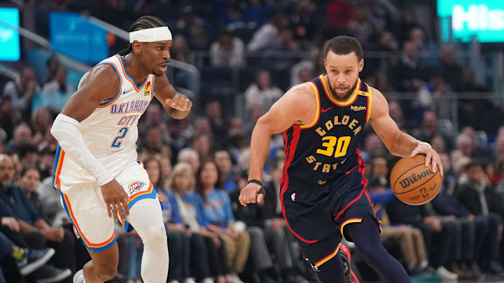 Jan 29, 2025; San Francisco, California, USA; Golden State Warriors guard Stephen Curry (30) dribbles the ball against Oklahoma City Thunder guard Shai Gilgeous-Alexander (2) in the first quarter at the Chase Center. Mandatory Credit: Cary Edmondson-Imagn Images
