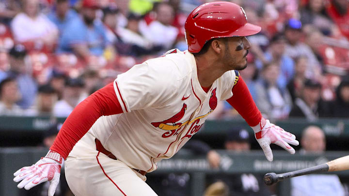 Mar 29, 2025; St. Louis, Missouri, USA;  St. Louis Cardinals third baseman Nolan Arenado (28) hits a one run single against the Minnesota Twins during the first inning at Busch Stadium. 