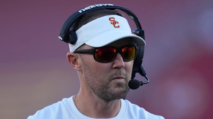 Oct 21, 2023; Los Angeles, California, USA; Southern California Trojans head coach Lincoln Riley watches from the sidelines against the Utah Utes in the first half at United Airlines Field at Los Angeles Memorial Coliseum. Mandatory Credit: Kirby Lee-Imagn Images
