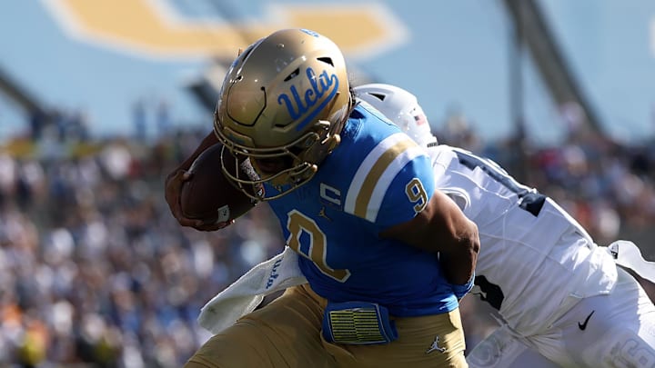 Oct 4, 2025; Pasadena, California, USA;  UCLA Bruins quarterback Nico Iamaleava (9) runs for a touchdown during the fourth quarter against the Penn State Nittany Lions at Rose Bowl. Mandatory Credit: Kiyoshi Mio-Imagn Images