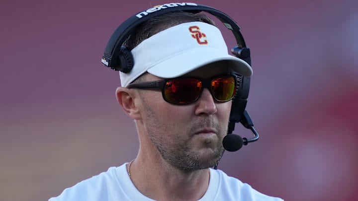 Oct 21, 2023; Los Angeles, California, USA; Southern California Trojans head coach Lincoln Riley watches from the sidelines against the Utah Utes in the first half at United Airlines Field at Los Angeles Memorial Coliseum. Mandatory Credit: Kirby Lee-Imagn Images