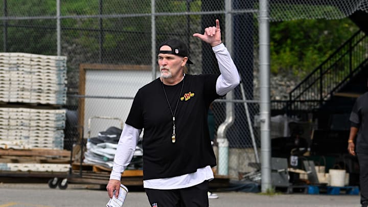 Aug 6, 2025; Foxborough, MA, USA; Washington Commanders head coach Dan Quinn arrives walks to the practice field after his press conference at training camp at Gillette Stadium. Mandatory Credit: Eric Canha-Imagn Images