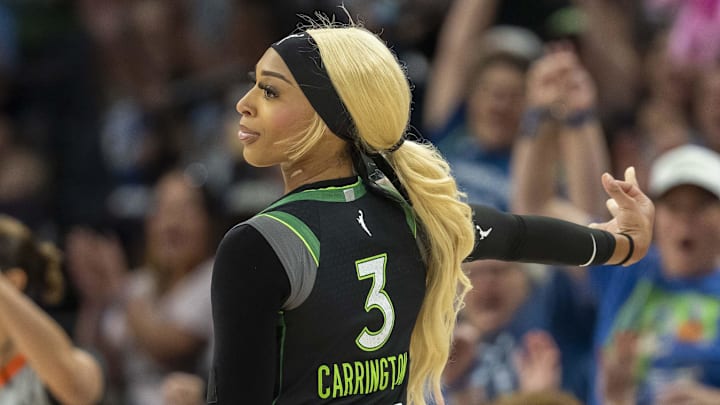 Minnesota Lynx guard DiJonai Carrington celebrates making a shot against the Golden State Valkyries.