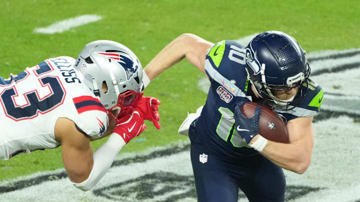 Feb 8, 2026; Santa Clara, CA, USA; Seattle Seahawks wide receiver Cooper Kupp (10) catches a pass against New England Patriots linebacker Christian Elliss (53) in the second half in Super Bowl LX at Levi's Stadium. Mandatory Credit: Kirby Lee-Imagn Images