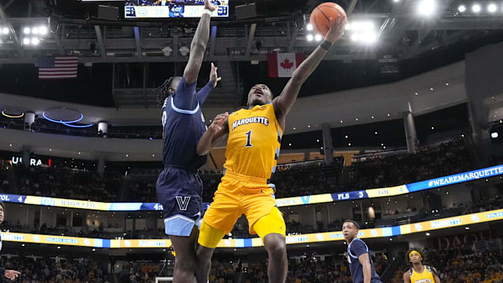 Jan 24, 2025; Milwaukee, Wisconsin, USA;  Marquette Golden Eagles guard Kam Jones (1) shoots during the first half against the Villanova Wildcats at Fiserv Forum. Mandatory Credit: Jeff Hanisch-Imagn Images