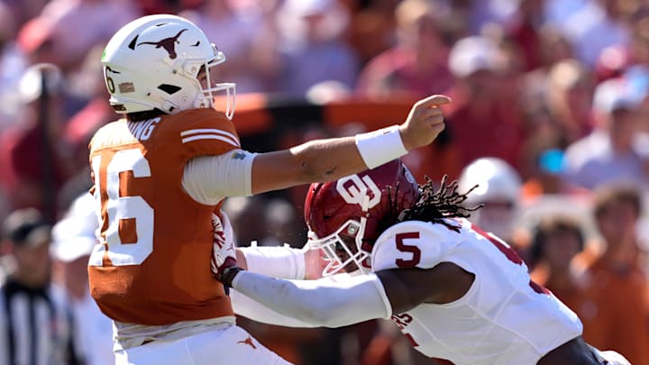 Oklahoma Sooners linebacker Kendal Daniels (5) pressures Texas Longhorns quarterback Arch Manning (16) Oklahoma Sooners linebacker Kendal Daniels (5) pressures Texas Longhorns quarterback Arch Manning (16)