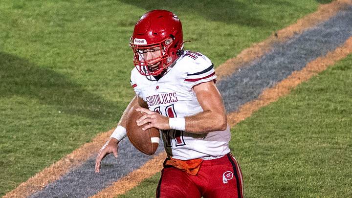 Santaluces quarterback Dallas Crescenzo runs away a defender,