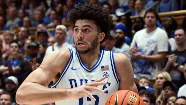 Mar 7, 2026; Durham, North Carolina, USA; Duke Blue Devils forward Cameron Boozer (12) controls the ball during the second half against the North Carolina Tar Heels at Cameron Indoor Stadium.  The Duke Blue Devils won 76-61. Mandatory Credit: Rob Kinnan-Imagn Images