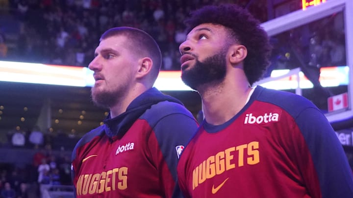 Oct 28, 2024; Toronto, Ontario, CAN; Denver Nuggets center Nikola Jokic (left) and guard Jamal Murray (right) during the anthems before a game against the Toronto Raptors at Scotiabank Arena.