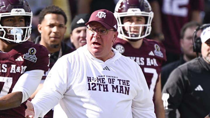 Texas A&M Aggies head coach Mike Elko reacts to a call during the game between the Aggies and the Hurricanes at Kyle Field. Texas A&M Aggies head coach Mike Elko reacts to a call during the game between the Aggies and the Hurricanes at Kyle Field.