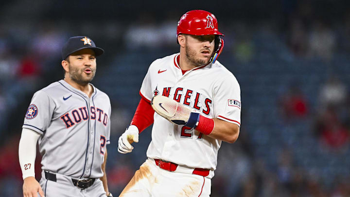 Sep 27, 2025; Anaheim, California, USA; Los Angeles Angels designated hitter Mike Trout (27) runs to second base against Houston Astros second baseman Jose Altuve (27) during the first inning at Angel Stadium. Mandatory Credit: Jonathan Hui-Imagn Images