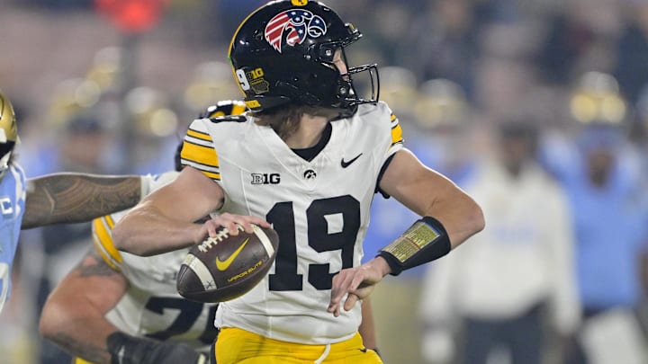 Nov 8, 2024; Pasadena, California, USA; UCLA Bruins defensive lineman Jay Toia (93) pressures Iowa Hawkeyes quarterback Jackson Stratton (19) as he throws a pass in the second half at the Rose Bowl. Mandatory Credit: Jayne Kamin-Oncea-Imagn Images Nov 8, 2024; Pasadena, California, USA; UCLA Bruins defensive lineman Jay Toia (93) pressures Iowa Hawkeyes quarterback Jackson Stratton (19) as he throws a pass in the second half at the Rose Bowl. Mandatory Credit: Jayne Kamin-Oncea-Imagn Images