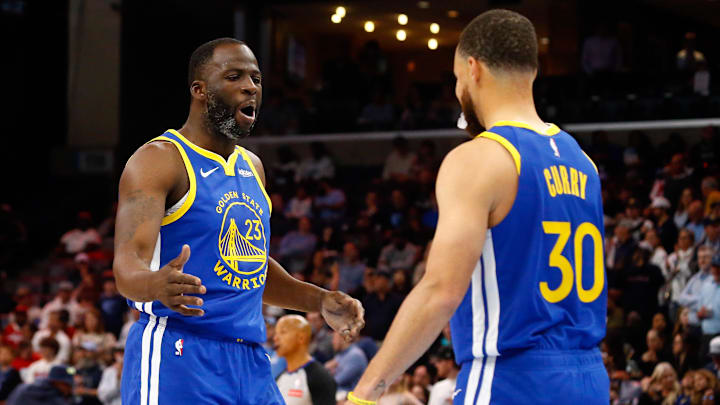 Golden State Warriors forward Draymond Green reacts with guard Stephen Curry after a play.