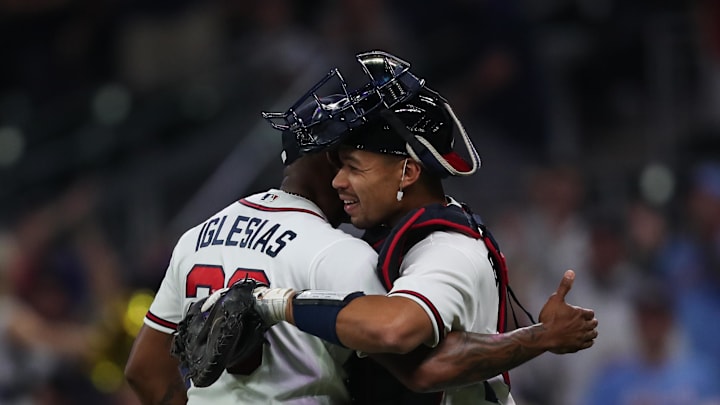 Apr 14, 2026; Cumberland, Georgia, USA; Atlanta Braves pitcher Raisel Iglesias (26) and catcher Drake Baldwin (30) embrace after a victory over the Miami Marlins at Truist Park. Mandatory Credit: Mady Mertens-Imagn Images