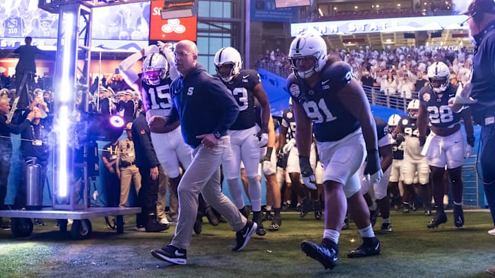 Penn State football head coach James Franklin leads the team onto the field prior to the game against the Boise State Broncos in the Fiesta Bowl at State Farm Stadium