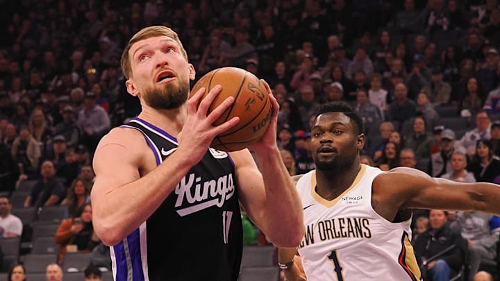 Feb 8, 2025; Sacramento, California, USA; Sacramento Kings center Domantas Sabonis (11) controls the ball against New Orleans Pelicans forward Zion Williamson (1) during the first quarter at Golden 1 Center.