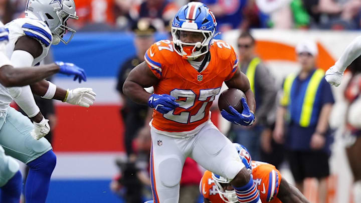 Oct 26, 2025; Denver, Colorado, USA; Denver Broncos running back J.K. Dobbins (27) runs against the Dallas Cowboys in the first half at Empower Field at Mile High. Oct 26, 2025; Denver, Colorado, USA; Denver Broncos running back J.K. Dobbins (27) runs against the Dallas Cowboys in the first half at Empower Field at Mile High.