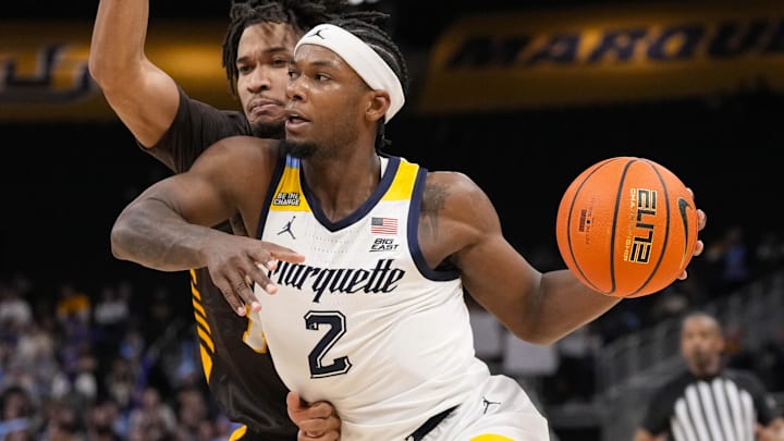 Marquette Golden Eagles guard Chase Ross (2) drives for the basket Marquette Golden Eagles guard Chase Ross (2) drives for the basket