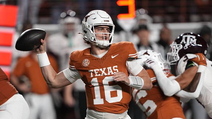 Texas Longhorns quarterback Arch Manning throws a pass during the first half against the Texas A&M Aggies. Texas Longhorns quarterback Arch Manning throws a pass during the first half against the Texas A&M Aggies.