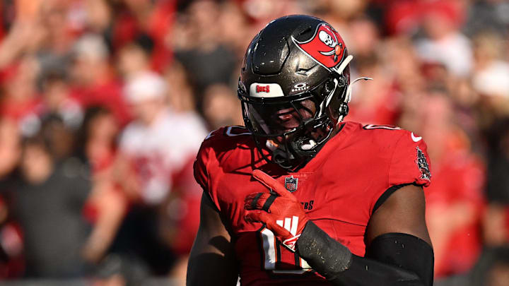 Jan 5, 2025; Tampa, Florida, USA; Tampa Bay Buccaneers linebacker Yaya Diaby (0) celebrates after getting a stop in the second half against the New Orleans Saints at Raymond James Stadium. Mandatory Credit: Jonathan Dyer-Imagn Images