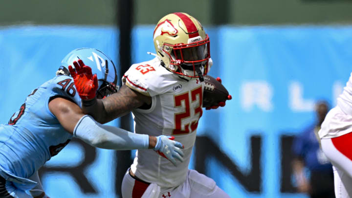 Mar 30, 2024; Arlington, TX, USA; Birmingham Stallions running back Ricky Person (23) stiff arms Arlington Renegades defensive back Myles Dorn (46) during the second half at Choctaw Stadium. Mandatory Credit: Jerome Miron-USA TODAY Sports
