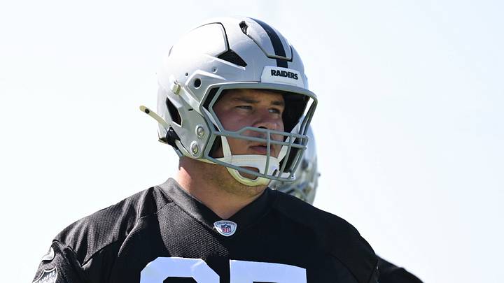 May 20, 2026; Henderson, NV, USA; Las Vegas Raiders center Tyler Linderbaum (65) warms up during organized team activities at Intermountain Health Performance Center. Mandatory Credit: Candice Ward-Imagn Images