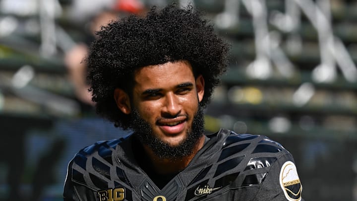 Sep 20, 2025; Eugene, Oregon, USA; Oregon Ducks quarterback Dante Moore (5) warms up before the game against the Oregon State Beavers at Autzen Stadium. Mandatory Credit: Troy Wayrynen-Imagn Images