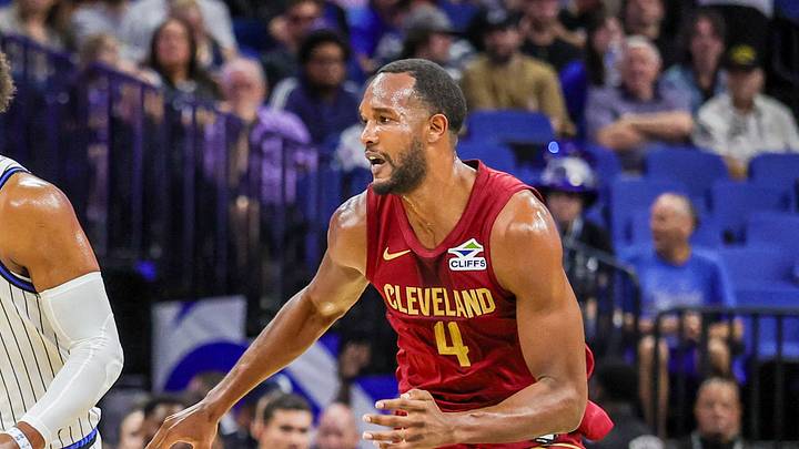 Oct 13, 2026; Orlando, Florida, USA;  Orlando Magic forward Paolo Banchero (5) brings the ball up court against Cleveland Cavaliers forward Evan Mobley (4) during the first quarter at Kia Center.  Mandatory Credit: Mike Watters-Imagn Images