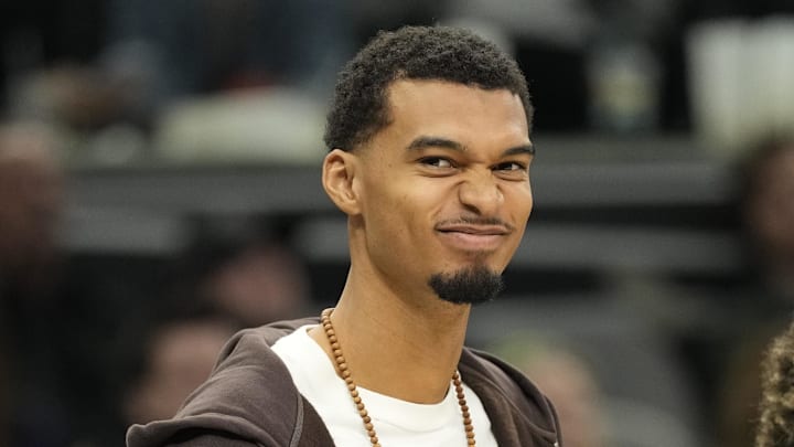 Dec 2, 2025; San Antonio, Texas, USA; San Antonio Spurs forward Victor Wembanyama (1) along with forward Carter Bryant (11) react from the bench during the second half against the Memphis Grizzlies at Frost Bank Center. Mandatory Credit: Scott Wachter-Imagn Images Dec 2, 2025; San Antonio, Texas, USA; San Antonio Spurs forward Victor Wembanyama (1) along with forward Carter Bryant (11) react from the bench during the second half against the Memphis Grizzlies at Frost Bank Center. Mandatory Credit: Scott Wachter-Imagn Images