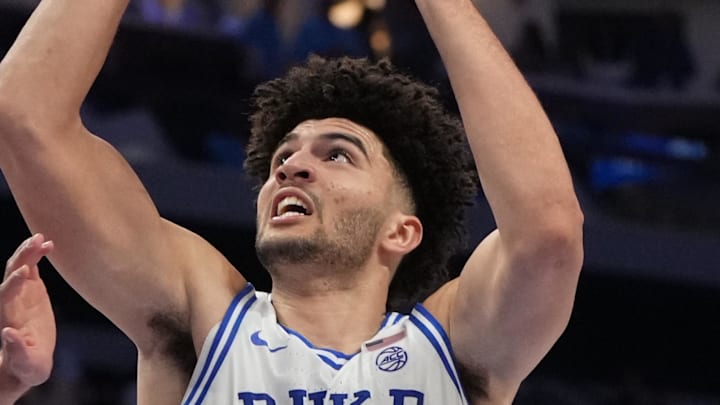 Mar 12, 2026; Charlotte, NC, USA; Duke Blue Devils forward Cameron Boozer (12) shoots as Florida State Seminoles forward Alex Steen (25) defends in the second half at Spectrum Center. Mandatory Credit: Bob Donnan-Imagn Images Mar 12, 2026; Charlotte, NC, USA; Duke Blue Devils forward Cameron Boozer (12) shoots as Florida State Seminoles forward Alex Steen (25) defends in the second half at Spectrum Center. Mandatory Credit: Bob Donnan-Imagn Images