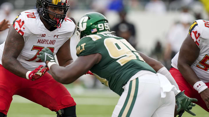 Sep 10, 2022; Charlotte, North Carolina, USA; Maryland Terrapins offensive lineman Amelio Moran (70) blocks Charlotte 49ers defensive end Miguel Jackson (95) during the second half at Jerry Richardson Stadium. Mandatory Credit: Jim Dedmon-Imagn Images Sep 10, 2022; Charlotte, North Carolina, USA; Maryland Terrapins offensive lineman Amelio Moran (70) blocks Charlotte 49ers defensive end Miguel Jackson (95) during the second half at Jerry Richardson Stadium. Mandatory Credit: Jim Dedmon-Imagn Images