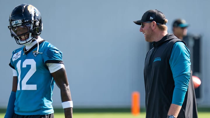 Jacksonville Jaguars wide receiver Travis Hunter (12) has a laugh with Jacksonville Jaguars head coach Liam Coen during the Jacksonville Jaguars’ third mandatory minicamp Thursday June 12, 2025 at the Miller Electric Center in Jacksonville, Fla. [Doug Engle/Florida Times-Union]