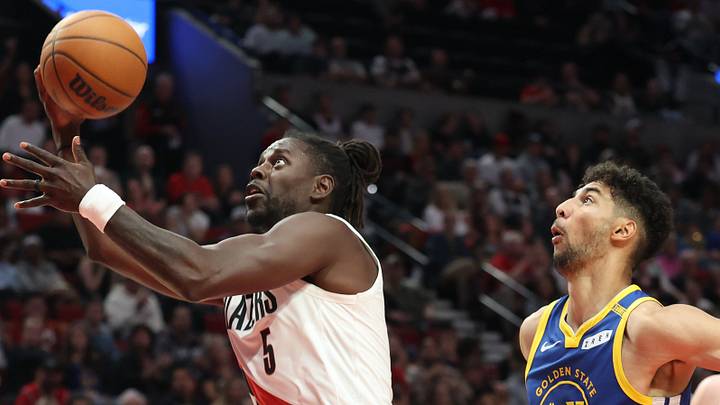Oct 7, 2026: Portland Trail Blazers guard Jrue Holiday shoots the ball over Golden State Warriors forward Malevy Leons during the second half at Moda Center.  Mandatory Credit: Jaime Valdez