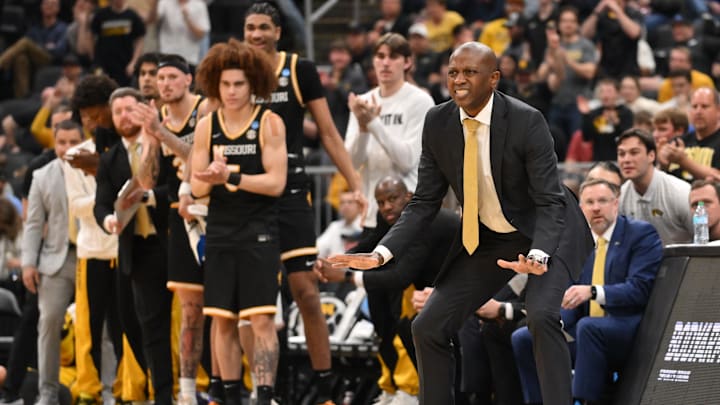 Mar 20, 2026; St. Louis, MO, USA; Missouri Tigers head coach Dennis Gates reacts during the game against Miami (FL) Hurricanes during a first round game of the men's 2026 NCAA Tournament at Enterprise Center. 
