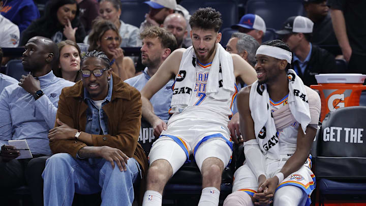 Nov 12, 2025; Oklahoma City, Oklahoma, USA; Oklahoma City Thunder guard Jalen Williams (8), center Chet Holmgren (7), and guard Shai Gilgeous-Alexander (2) talk while sitting on the bench during the fourth quarter against the Los Angeles Lakers at Paycom Center. Mandatory Credit: Alonzo Adams-Imagn Images